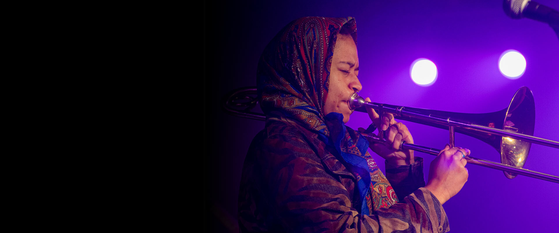 Female trombone player on stage